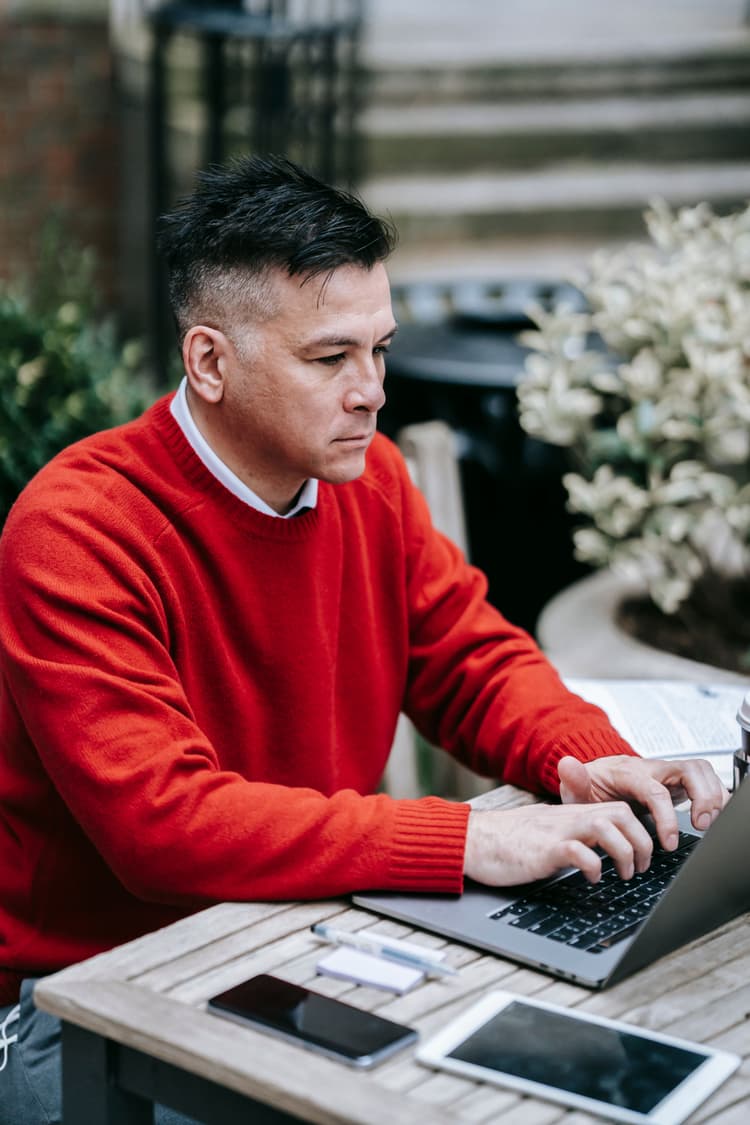 Logistics professional reviewing shipment information on a laptop